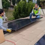 CalPacific Power solar panel installation on Bay Area home roof, workers in safety gear and harnesses.