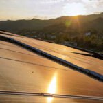 Ground-mounted solar panel system in Livermore, California with a scenic sunset view
