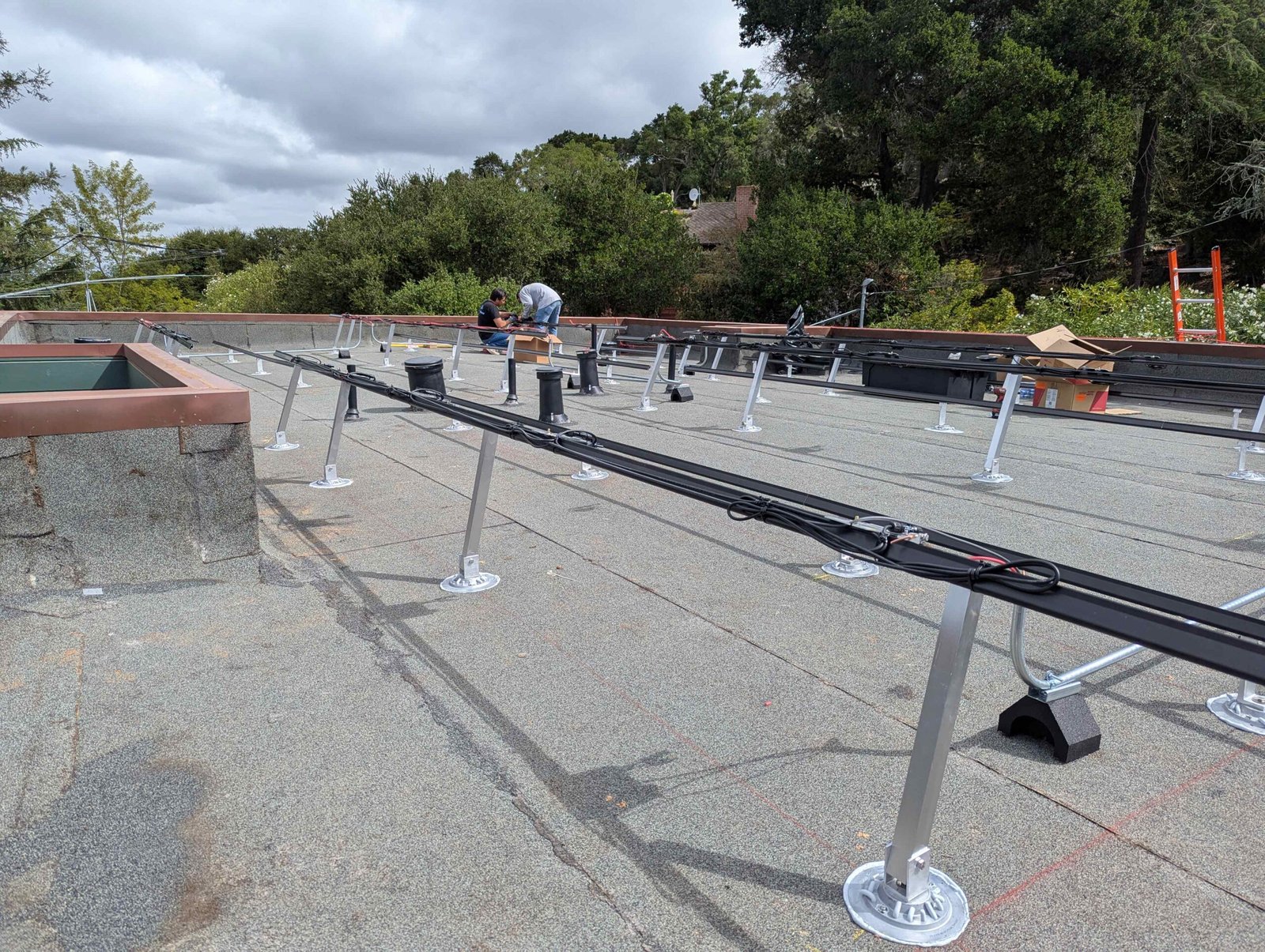 CalPacific Power installers aligning solar panels during 3.2 kW rooftop solar project in Los Gatos, California.