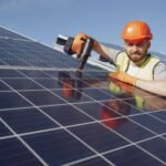 Technician installing solar panels on a rooftop in Los Gatos, California — CalPacific Power solar installation service.